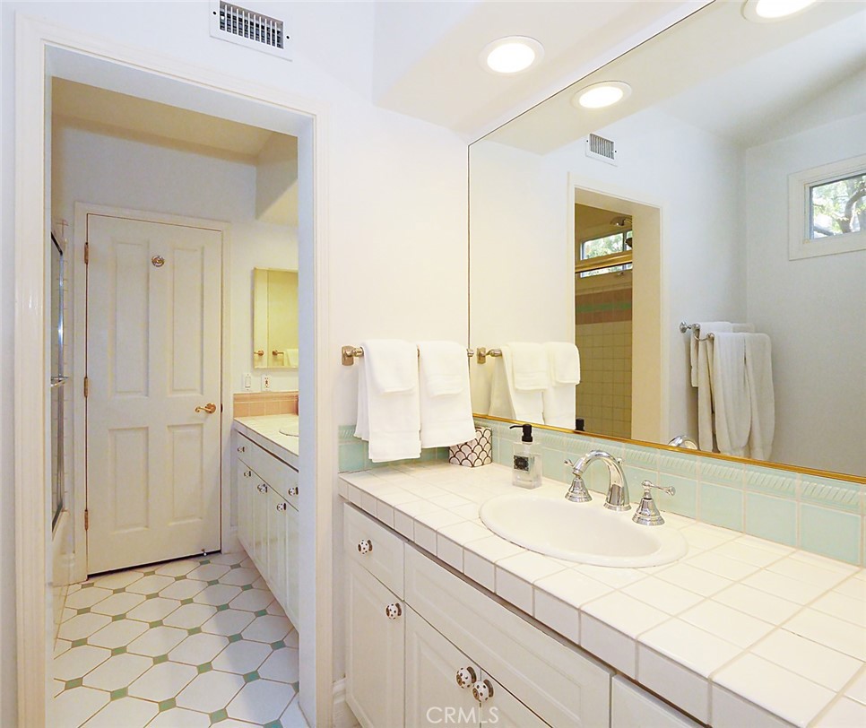 7 Hillcrest Meadows Rolling Hills Estates, CA 90274 - Photo 35 of 49 a bathroom with a sink and a mirror