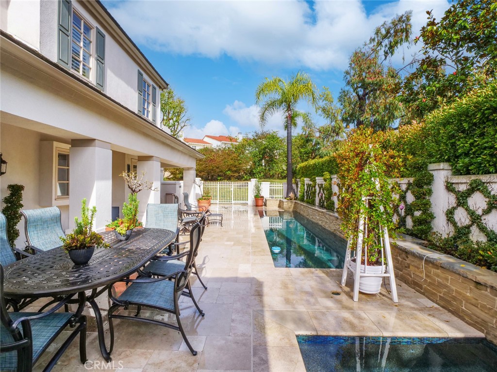 7 Hillcrest Meadows Rolling Hills Estates, CA 90274 - Photo 43 of 49 a view of a patio with table and chairs and potted plants