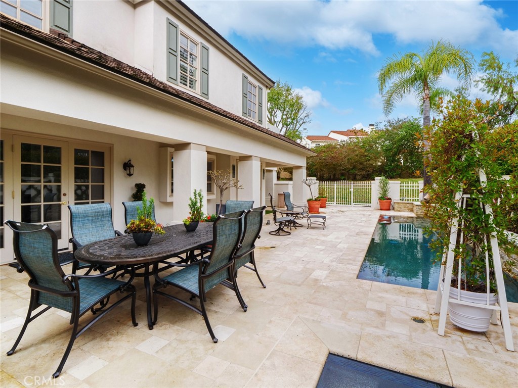 7 Hillcrest Meadows Rolling Hills Estates, CA 90274 - Photo 45 of 49 a view of a patio with table and chairs and potted plants