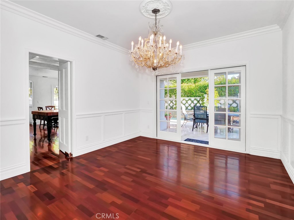 7 Hillcrest Meadows Rolling Hills Estates, CA 90274 - Photo 9 of 49 a view of a room with wooden floor potted plant and a chandelier