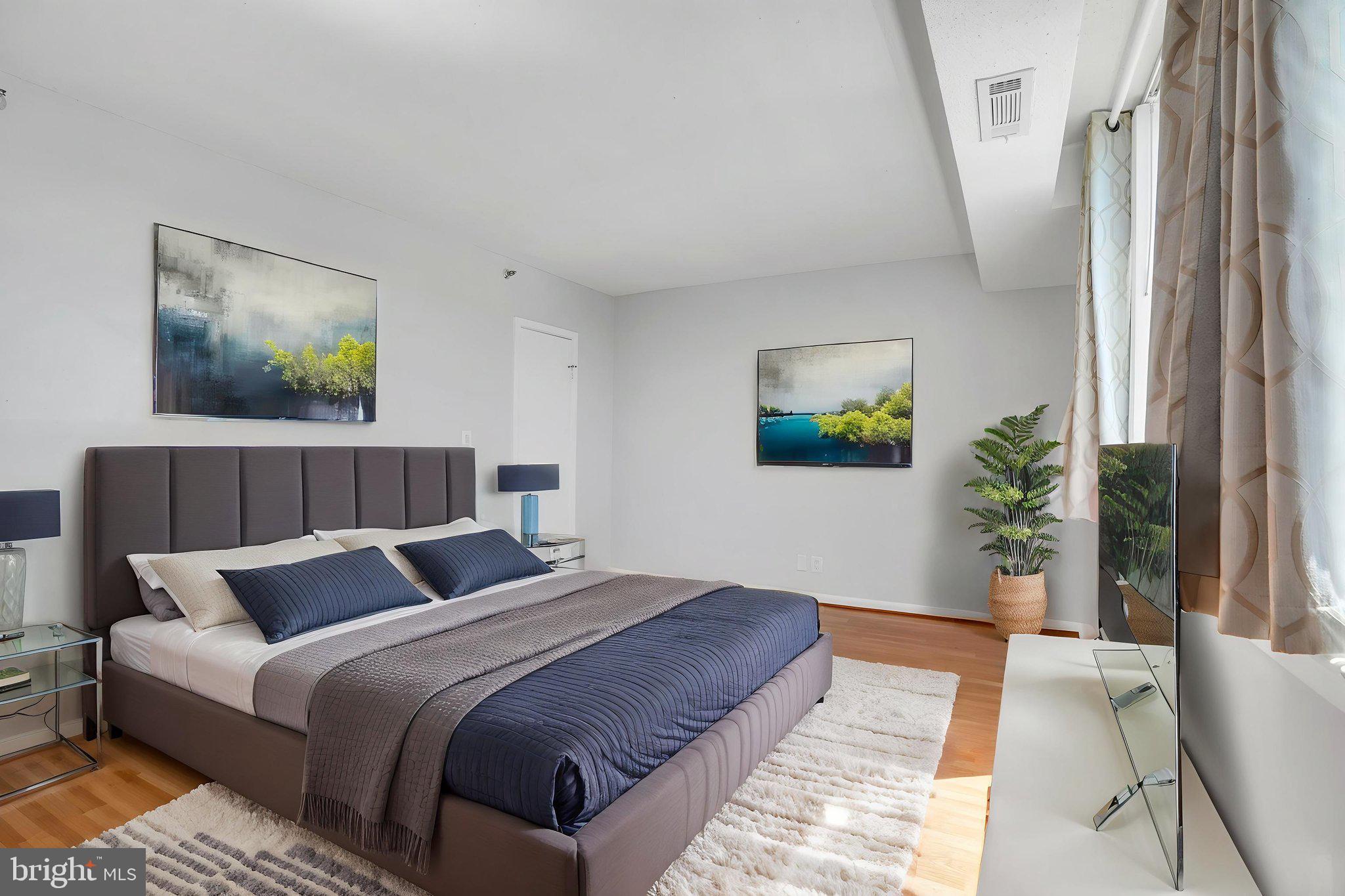 5501 Seminary Road, Unit 1908S Falls Church, VA 22041 - Photo 29 of 43 a bedroom with a large bed and a couch