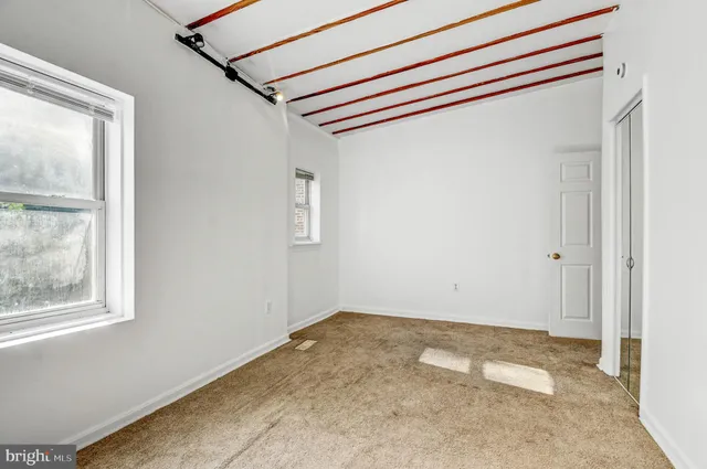 a bathroom with a sink a toilet a bathtub and shower