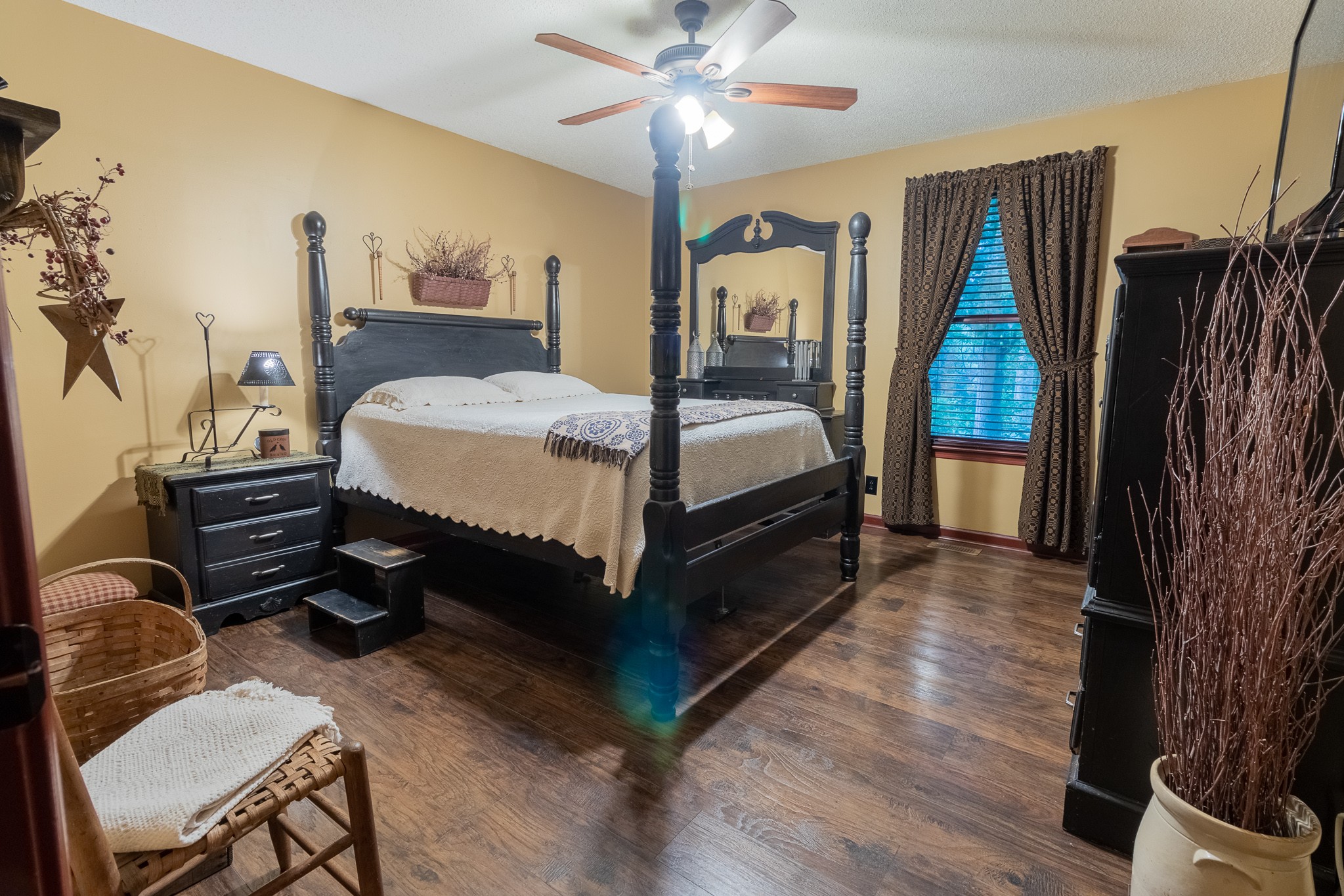 746 Needmore Road Clarksville, TN 37040 - Photo 8 of 14 a spacious bedroom with a bed and wooden floor