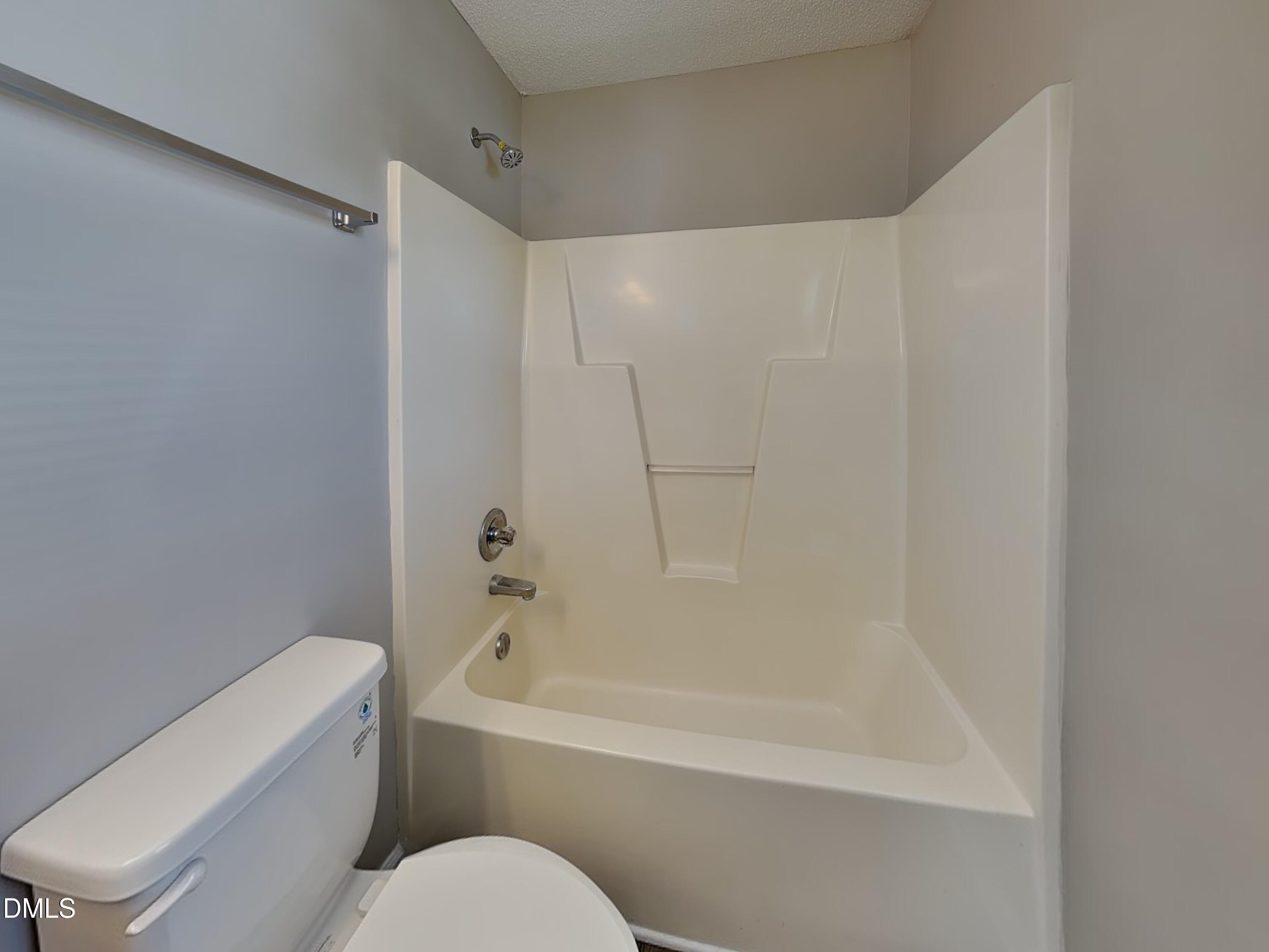 4409 Woodlawn Drive Raleigh, NC 27616 - Photo 10 of 15 a white bath tub sitting next to a white toilet and sink