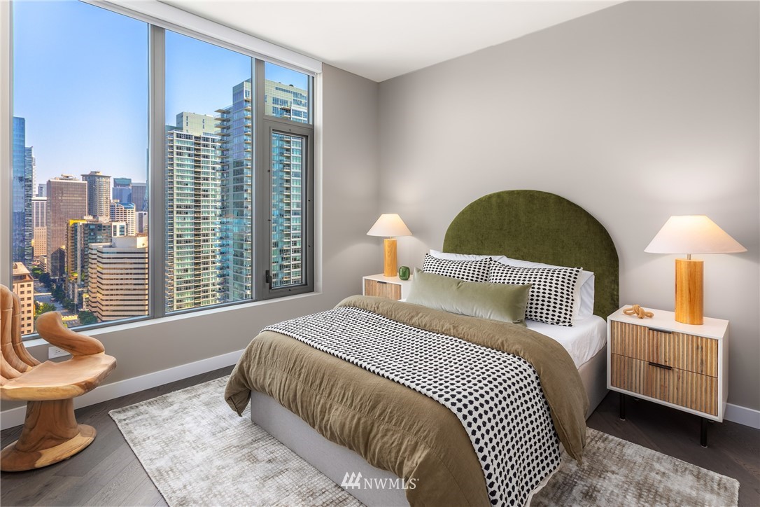 2510 6th Avenue, Unit 3502 Seattle, WA 98121 - Photo 16 of 38 a bedroom with a bed and wooden floor