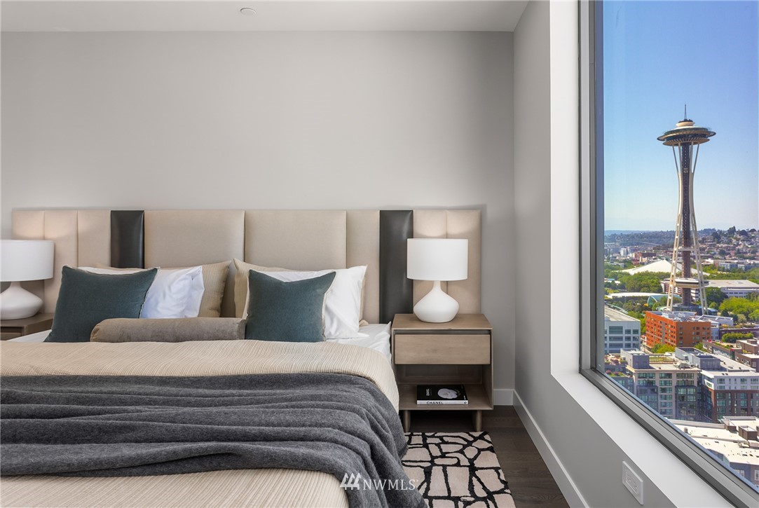 2510 6th Avenue, Unit 3502 Seattle, WA 98121 - Photo 17 of 38 a bedroom with a bed and wooden floor