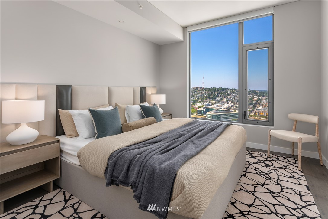 2510 6th Avenue, Unit 3502 Seattle, WA 98121 - Photo 19 of 38 a bedroom with a bed and a large window