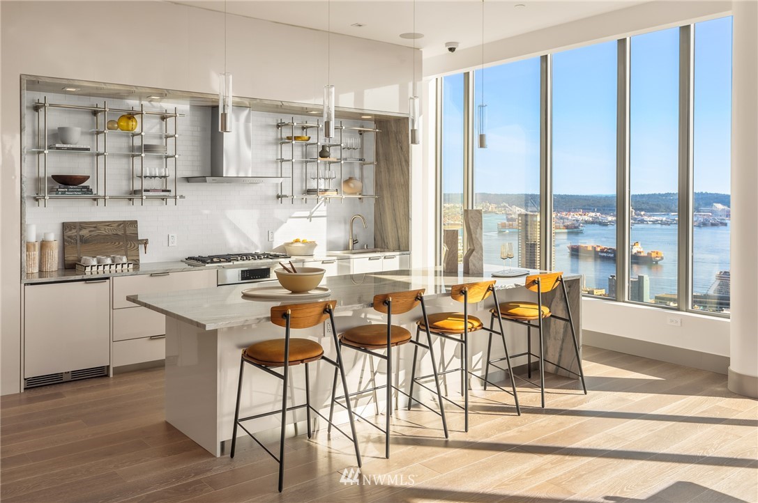 2510 6th Avenue, Unit 3502 Seattle, WA 98121 - Photo 27 of 38 a view of a dining room with furniture and wooden floor