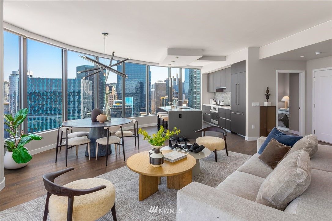 2510 6th Avenue, Unit 3502 Seattle, WA 98121 - Photo 7 of 38 a living room with furniture and a floor to ceiling window