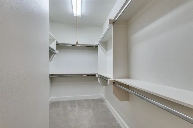 a bathroom with a double vanity sink mirror and shower
