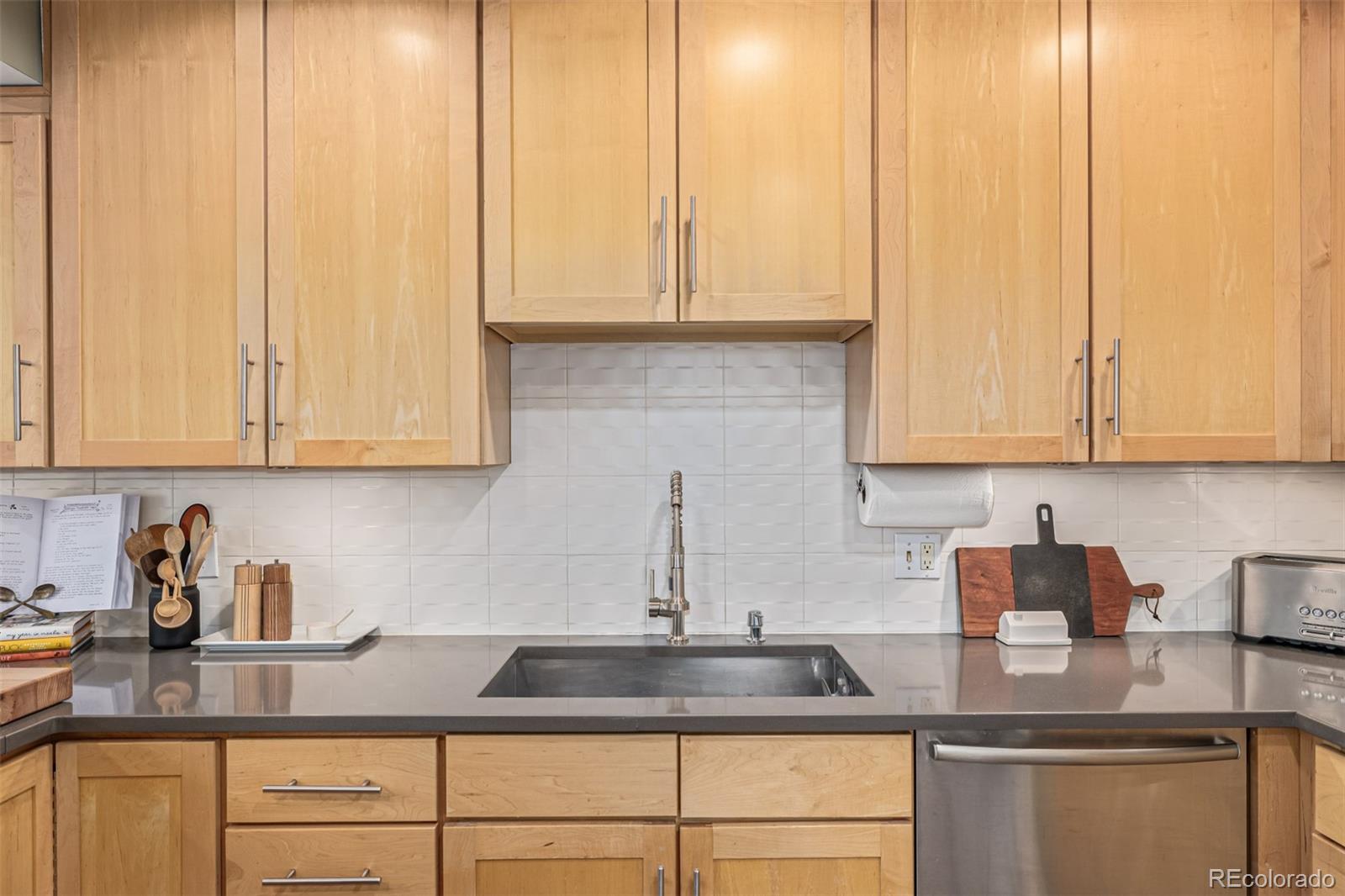 1227 Elm Street Denver, CO 80220 - Photo 13 of 44 a kitchen with granite countertop white cabinets and white appliances