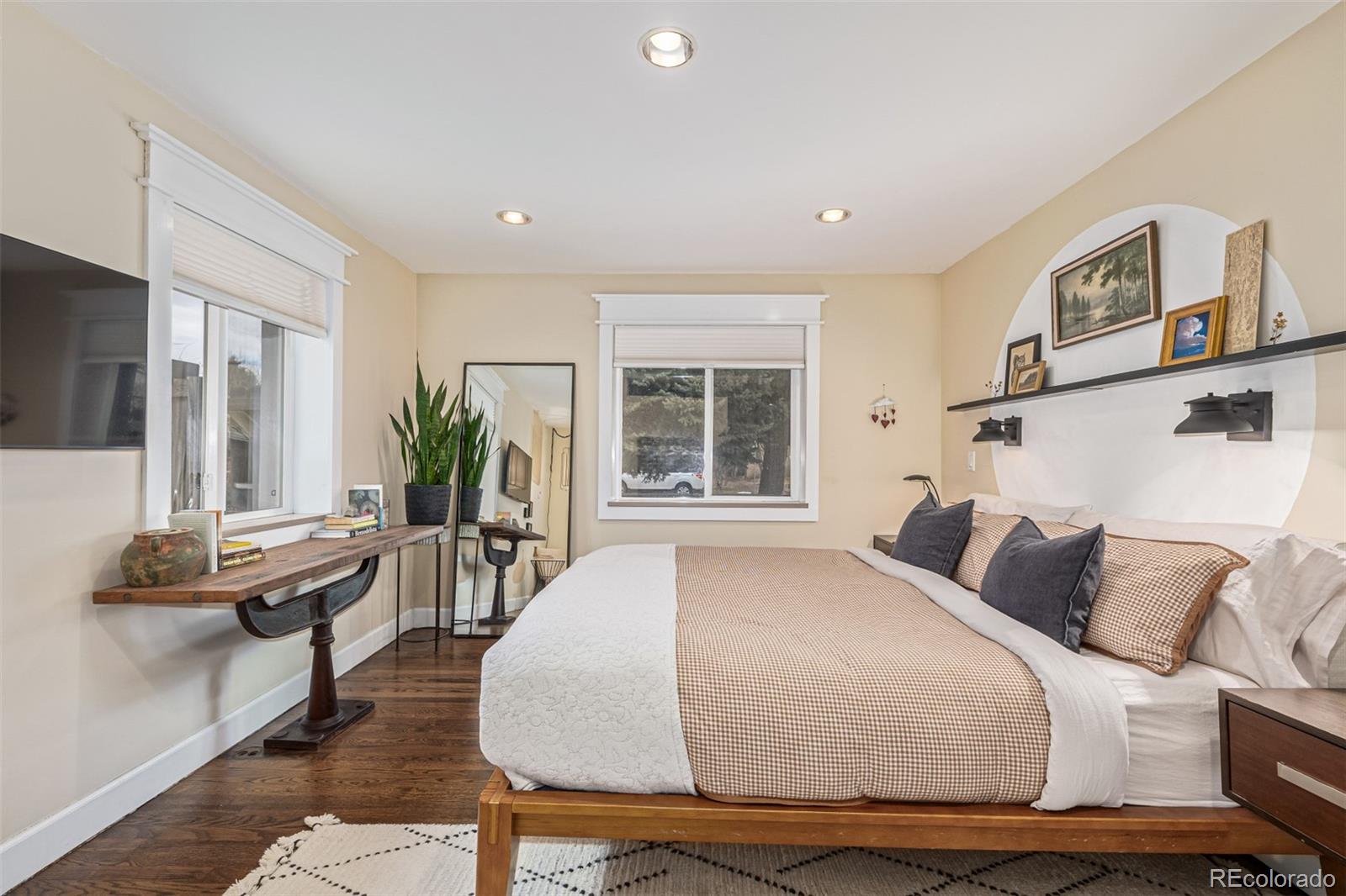 1227 Elm Street Denver, CO 80220 - Photo 14 of 44 a bedroom with furniture and a window