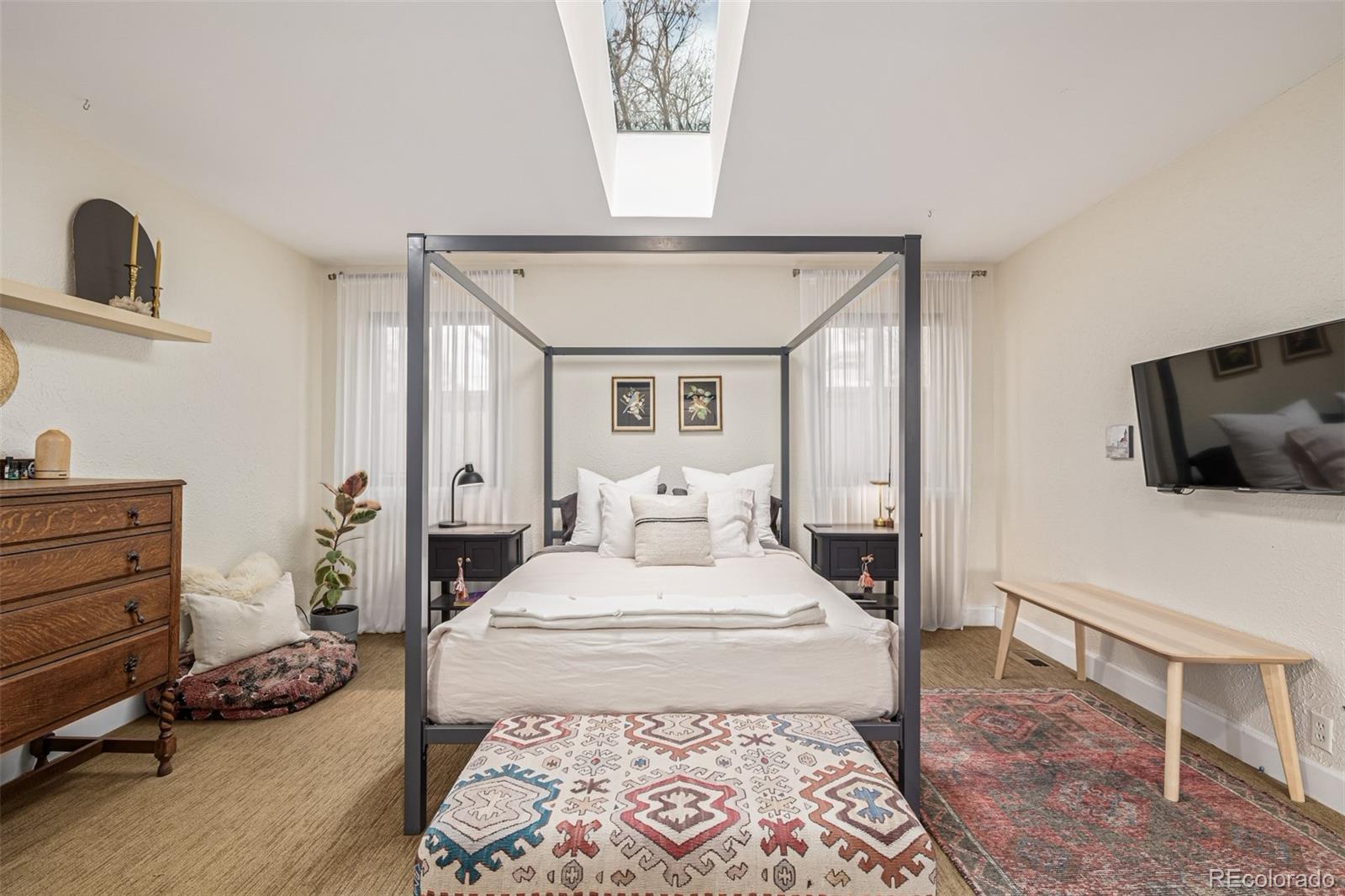 1227 Elm Street Denver, CO 80220 - Photo 19 of 44 a room with a bed and furniture