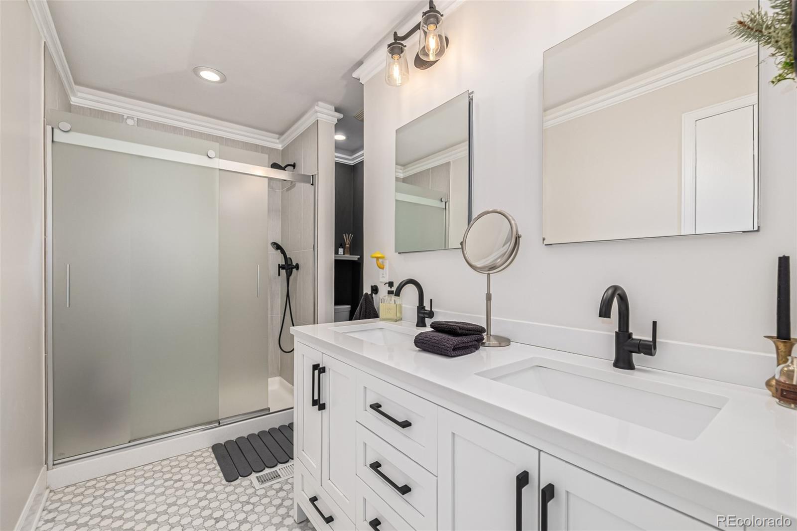 1227 Elm Street Denver, CO 80220 - Photo 21 of 44 a bathroom with a sink and a mirror