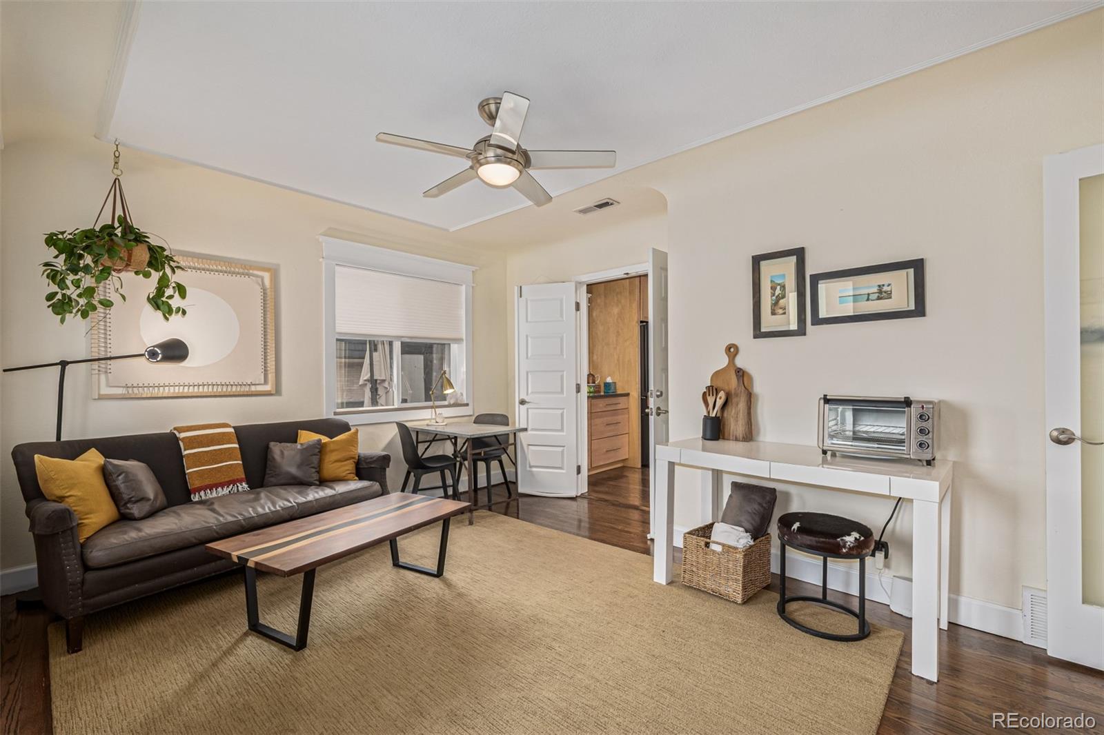 1227 Elm Street Denver, CO 80220 - Photo 22 of 44 a living room with furniture and a wooden floor