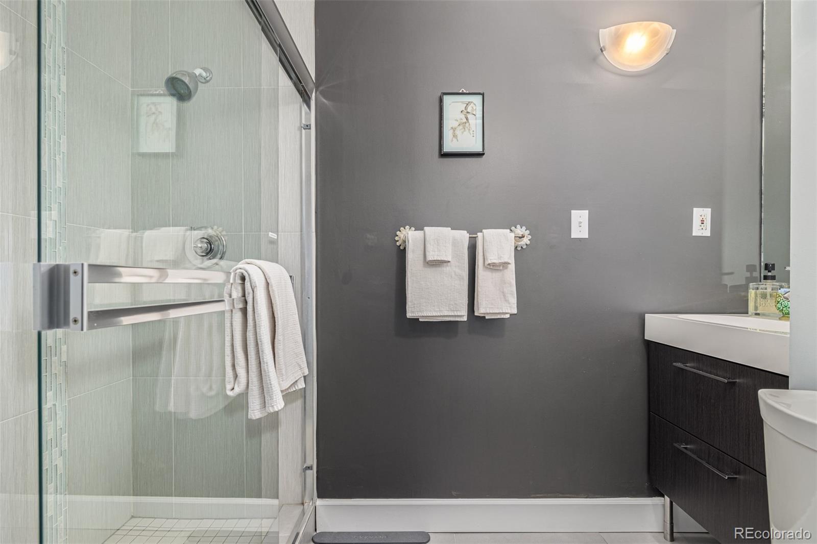 1227 Elm Street Denver, CO 80220 - Photo 26 of 44 a room with a sink and a mirror