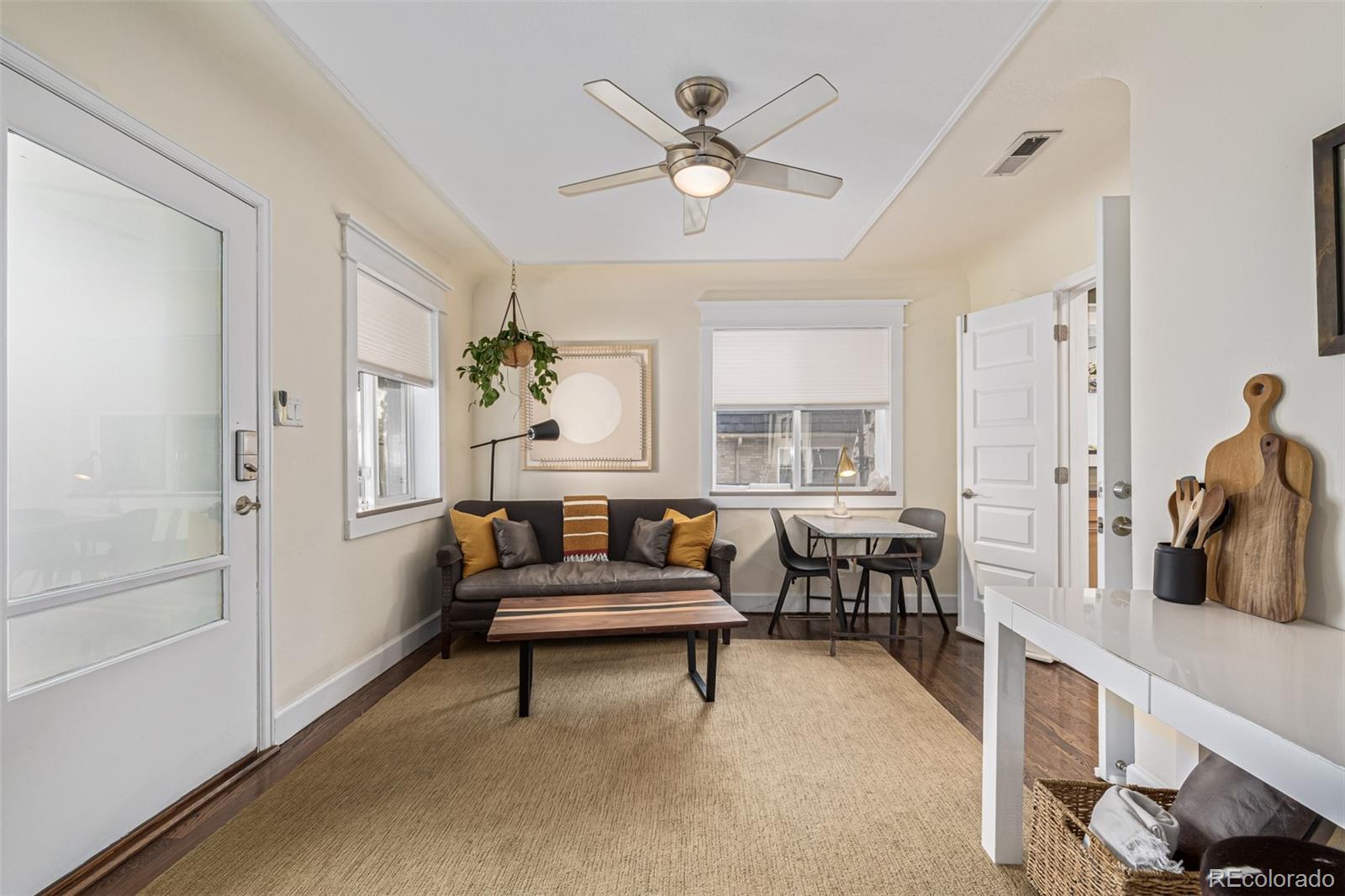 1227 Elm Street Denver, CO 80220 - Photo 31 of 44 a living room with furniture and white walls
