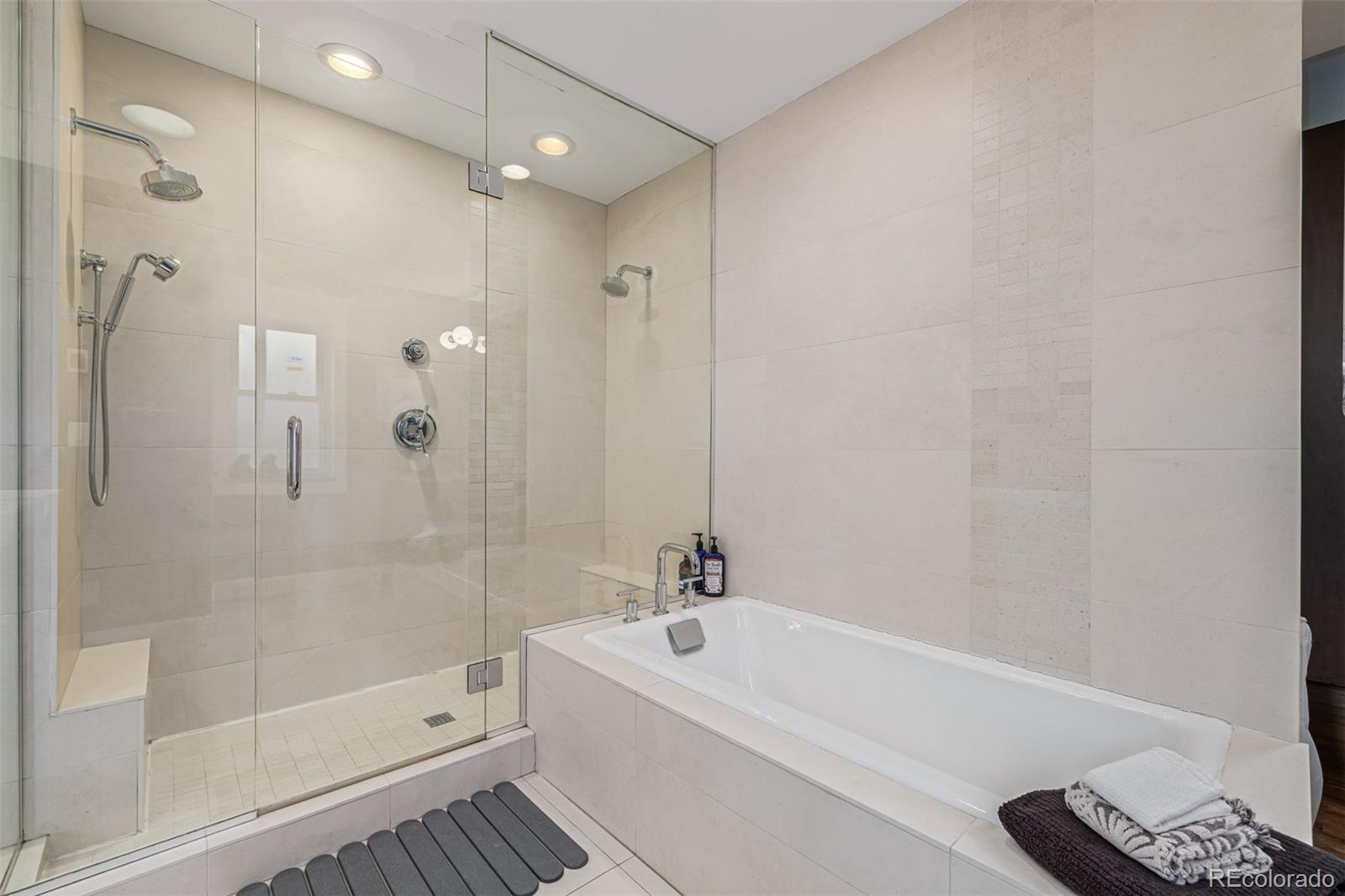 1227 Elm Street Denver, CO 80220 - Photo 33 of 44 a white bath tub sitting next to a white sink