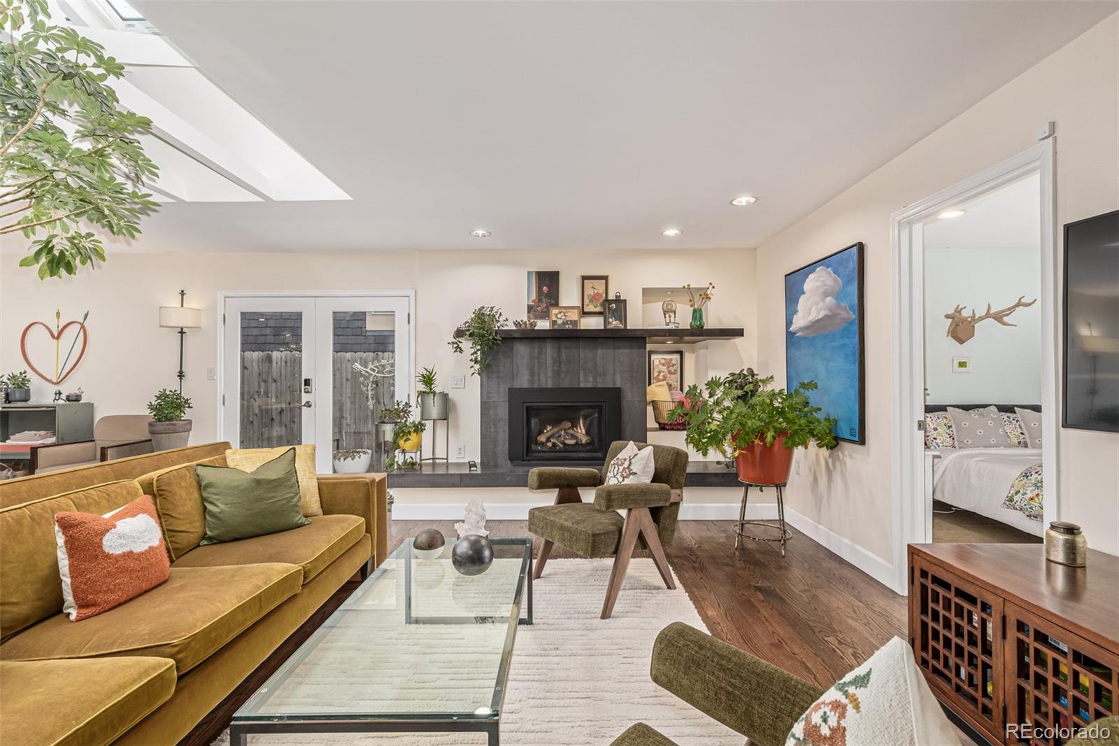 1227 Elm Street Denver, CO 80220 - Photo 4 of 44 a living room with furniture and a fireplace