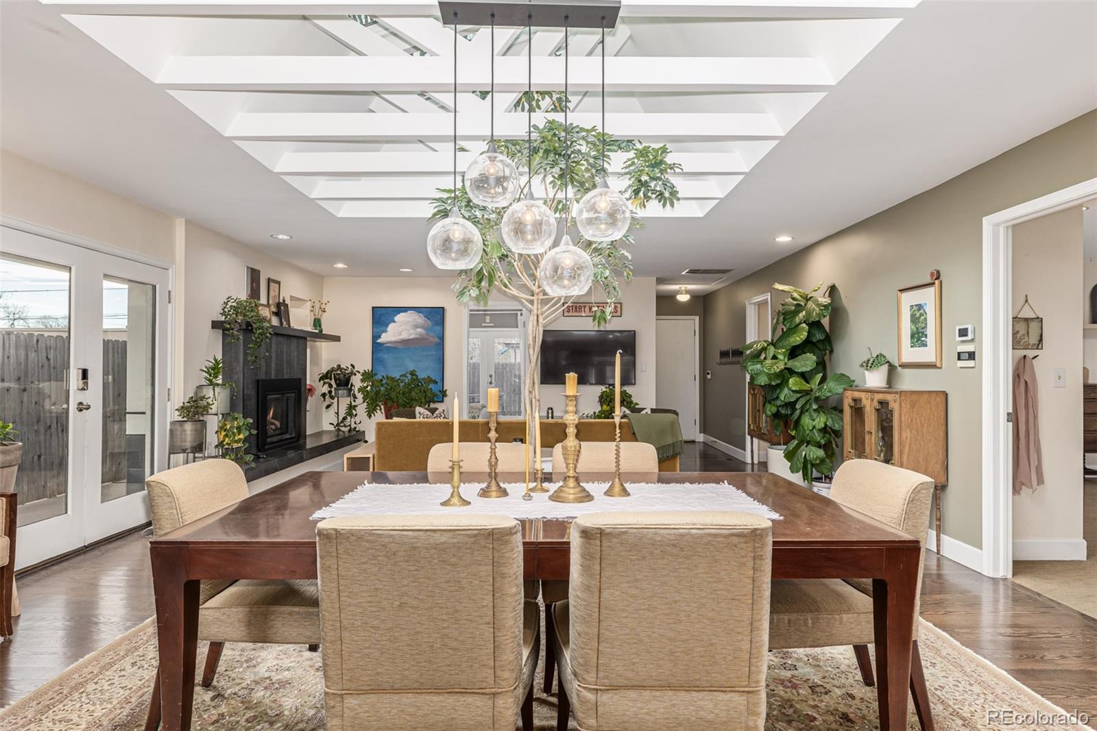 1227 Elm Street Denver, CO 80220 - Photo 7 of 44 a view of a dining room with furniture wooden floor and chandelier