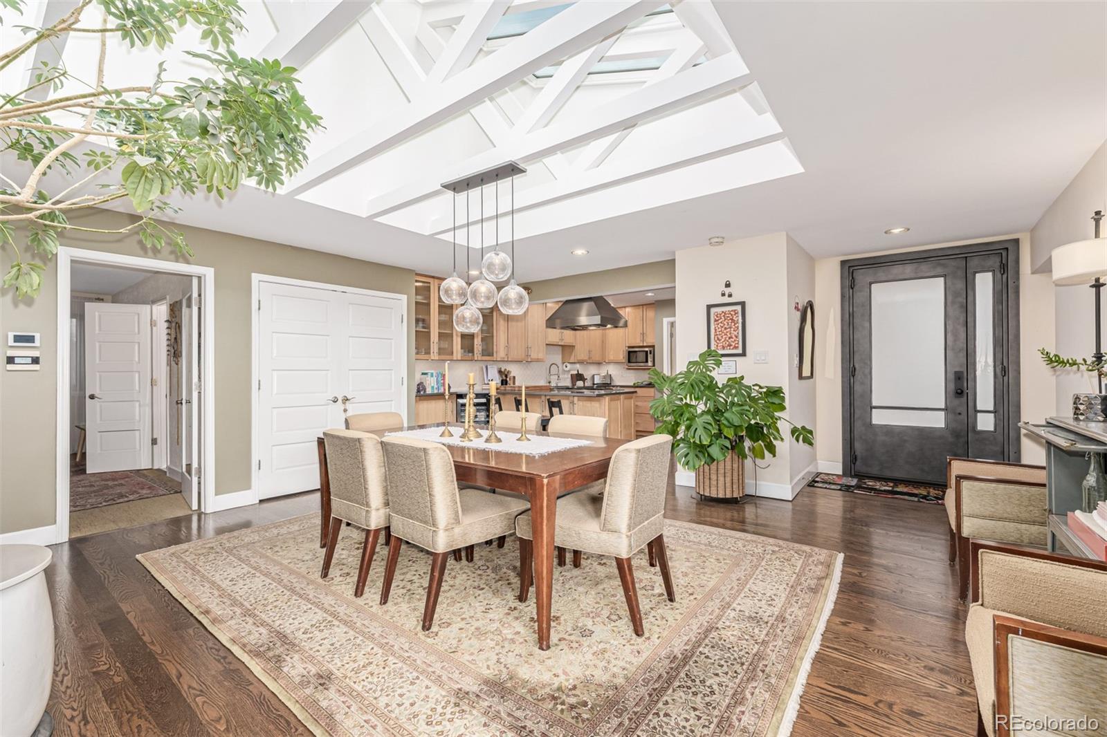 1227 Elm Street Denver, CO 80220 - Photo 9 of 44 a view of a dining room with furniture and wooden floor