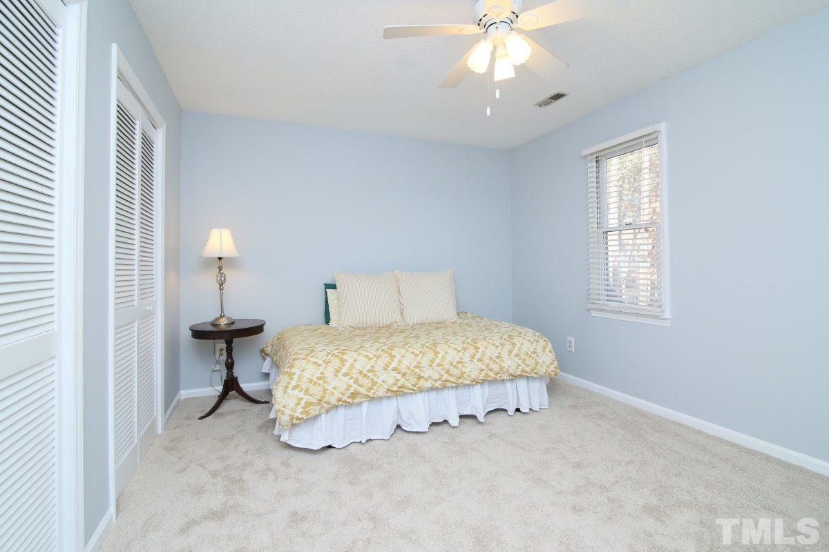 5649 Hamstead Crossing Raleigh, NC 27612 - Photo 17 of 25 a bedroom with bed and a window