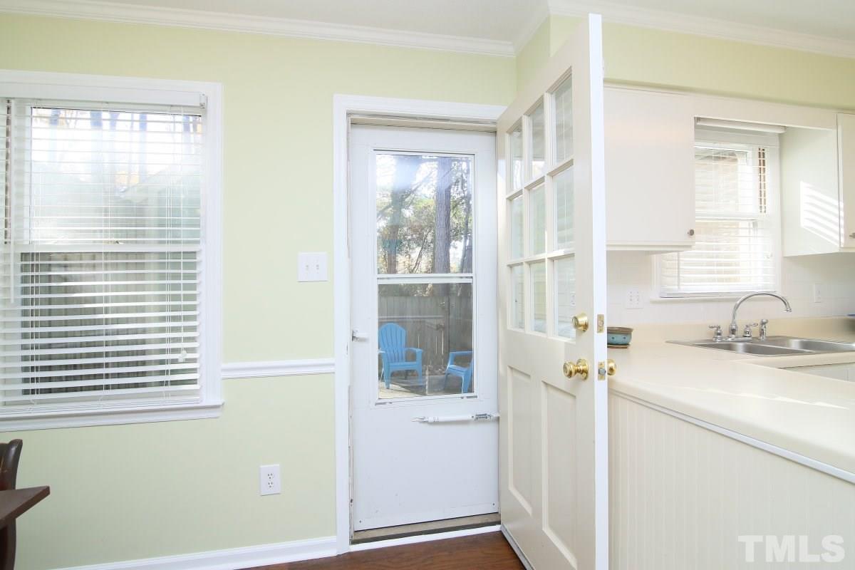 5649 Hamstead Crossing Raleigh, NC 27612 - Photo 18 of 25 a bathroom with a sink a mirror and next to a window