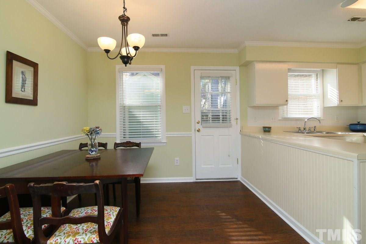 5649 Hamstead Crossing Raleigh, NC 27612 - Photo 7 of 25 a dining room with wooden floor
