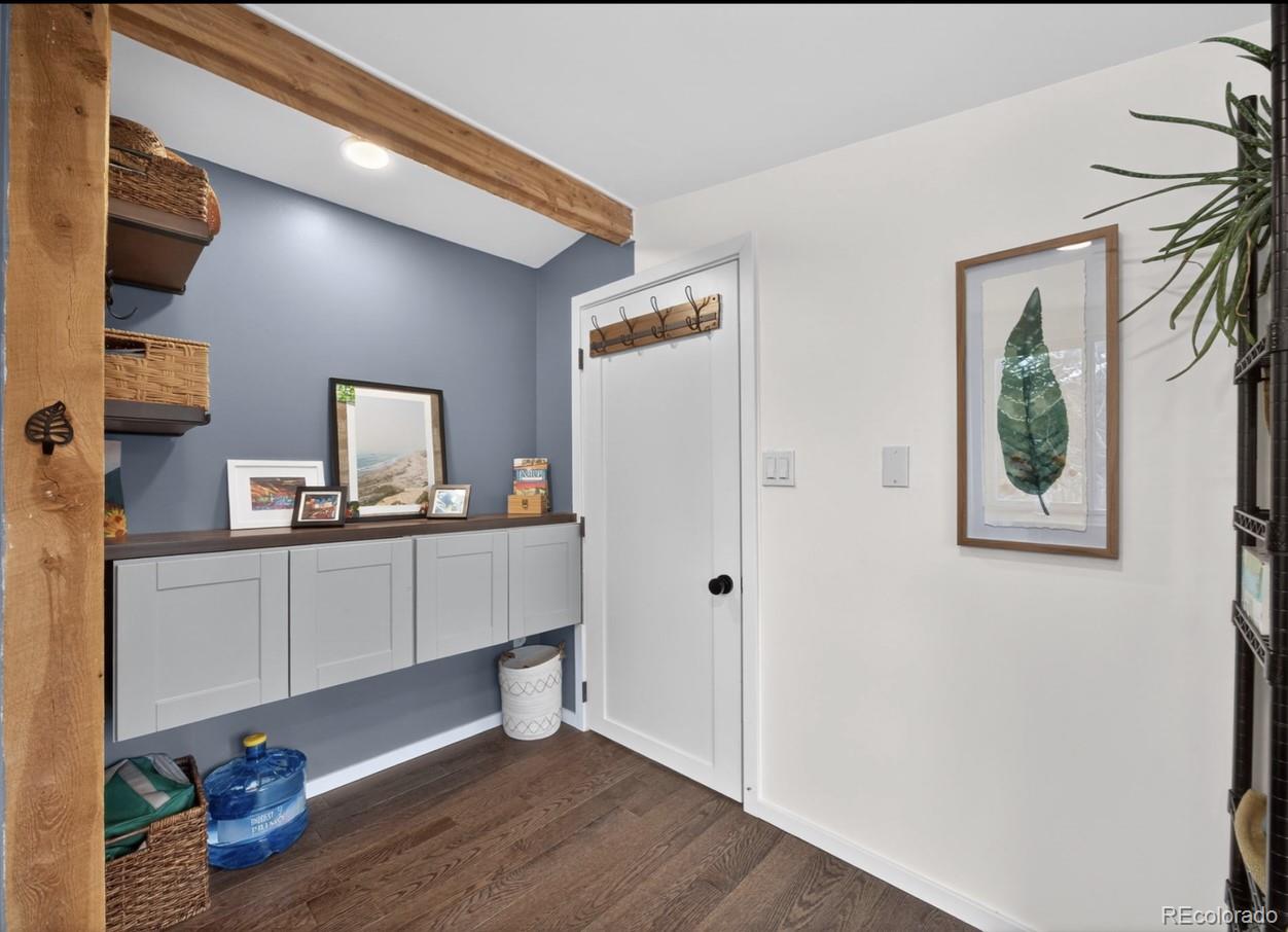 24 Signal Rock Road Golden, CO 80403 - Photo 17 of 26 a room with a couch and a wooden floor