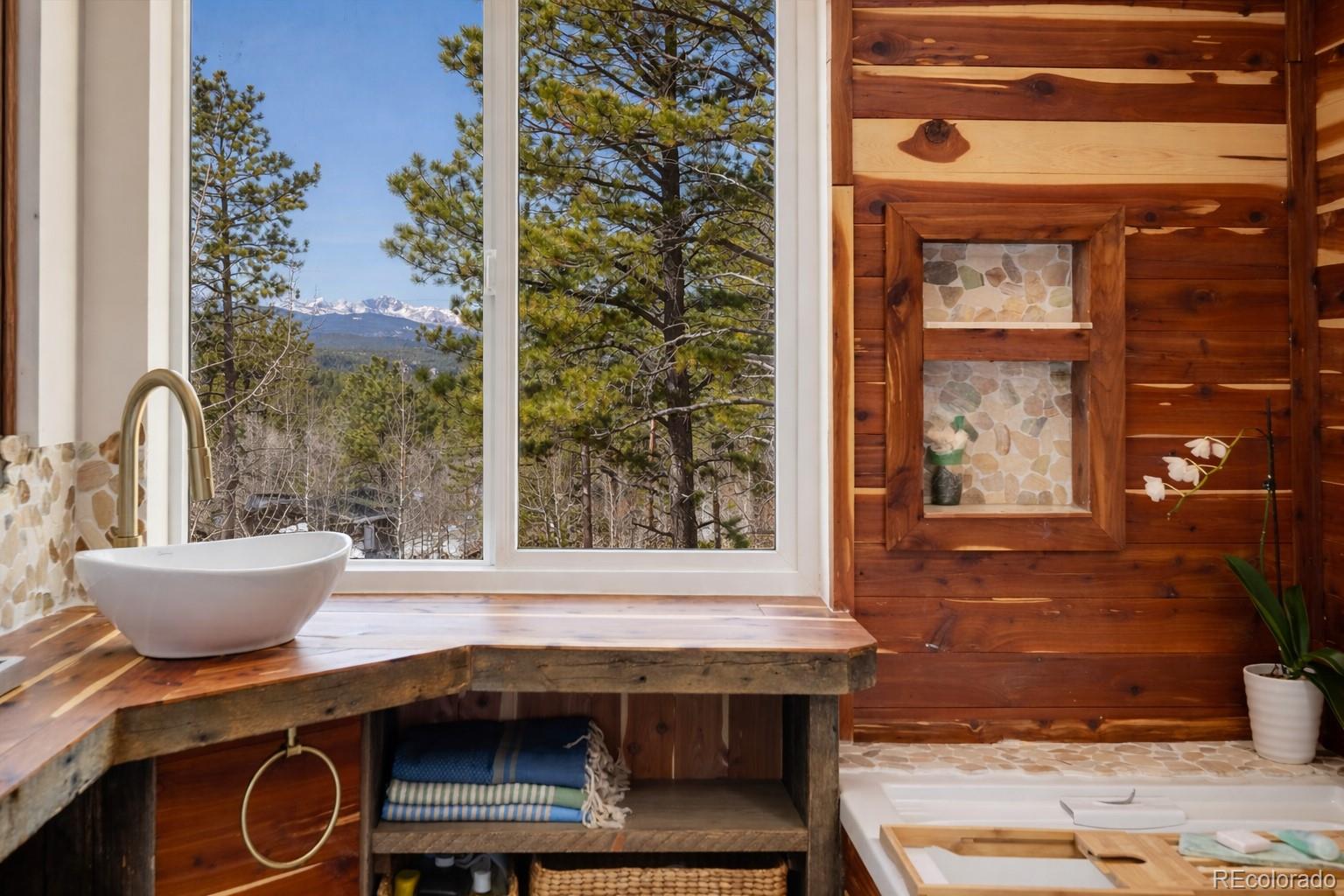 24 Signal Rock Road Golden, CO 80403 - Photo 18 of 26 a room with a table and chairs