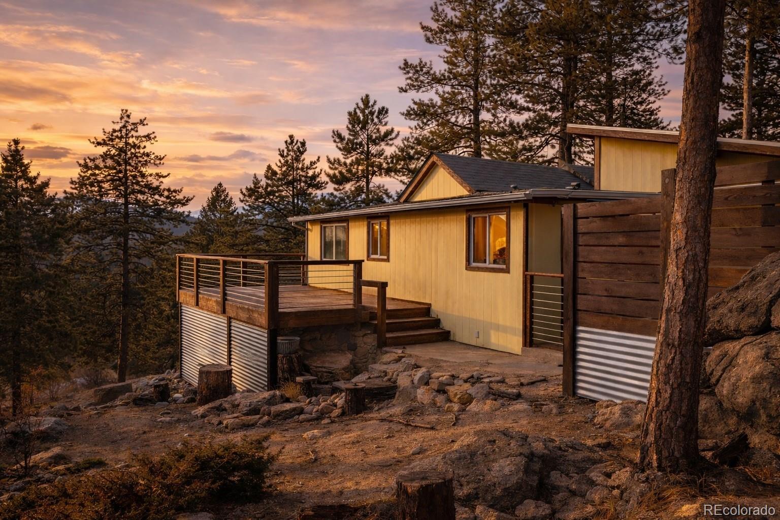 24 Signal Rock Road Golden, CO 80403 - Photo 2 of 26 a backyard of a house with lots of green space
