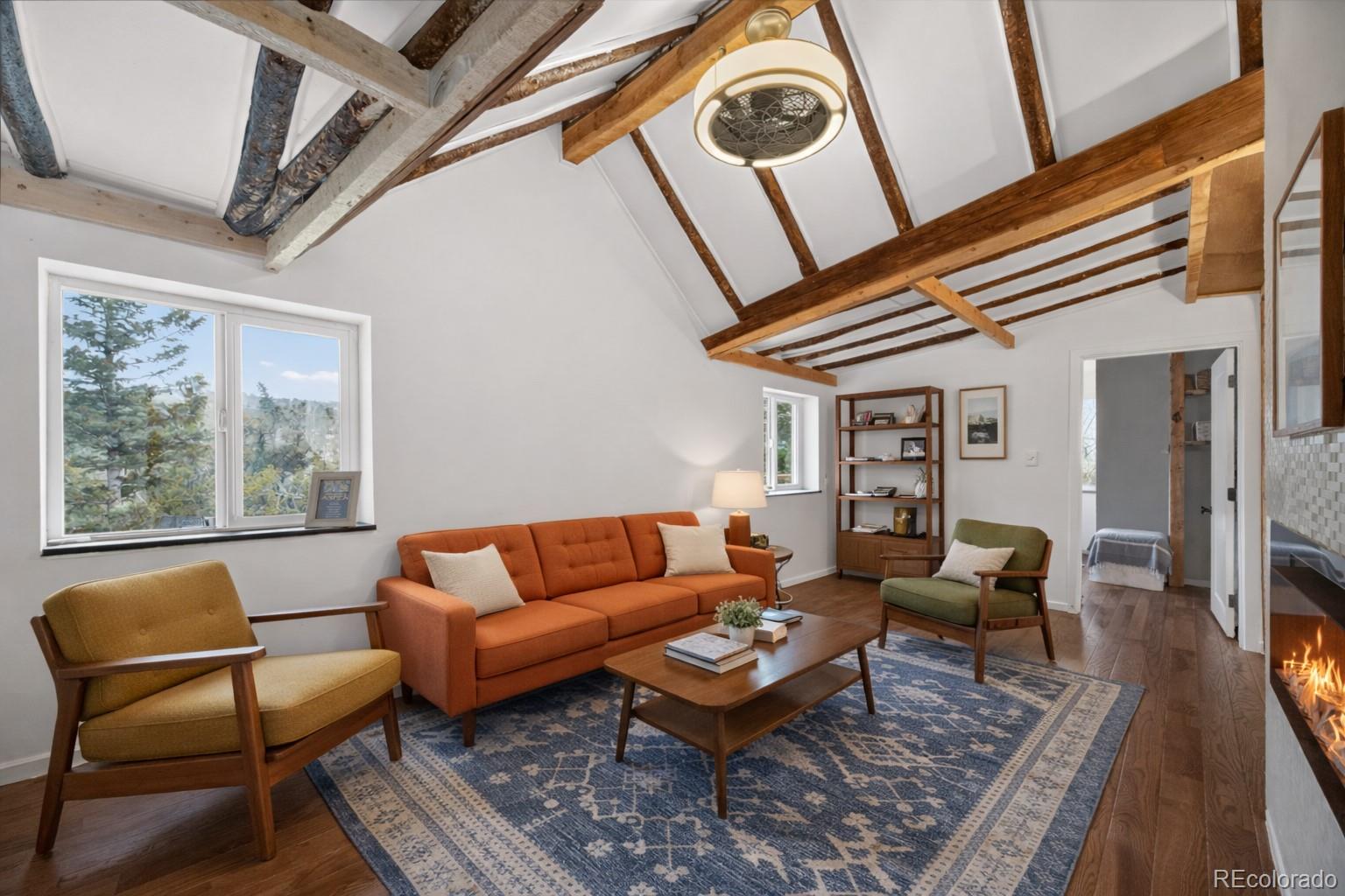 24 Signal Rock Road Golden, CO 80403 - Photo 5 of 26 a living room with furniture and a rug