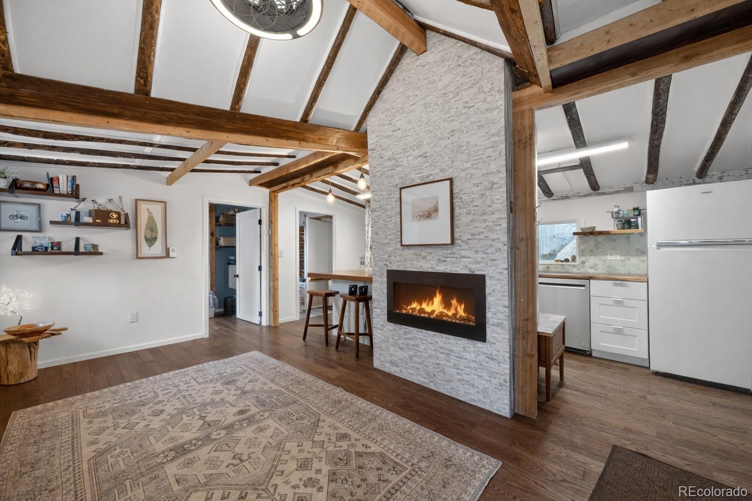24 Signal Rock Road Golden, CO 80403 - Photo 6 of 26 a living room with furniture and a fireplace
