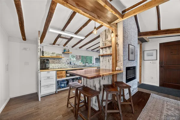 a view of a dining room with furniture window and wooden floor