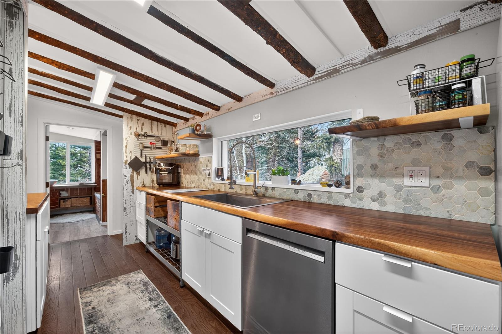 24 Signal Rock Road Golden, CO 80403 - Photo 9 of 26 a kitchen with stainless steel appliances granite countertop a sink and cabinets