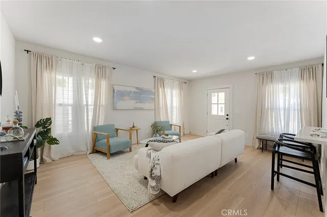 a spacious bedroom with a bed and a couch