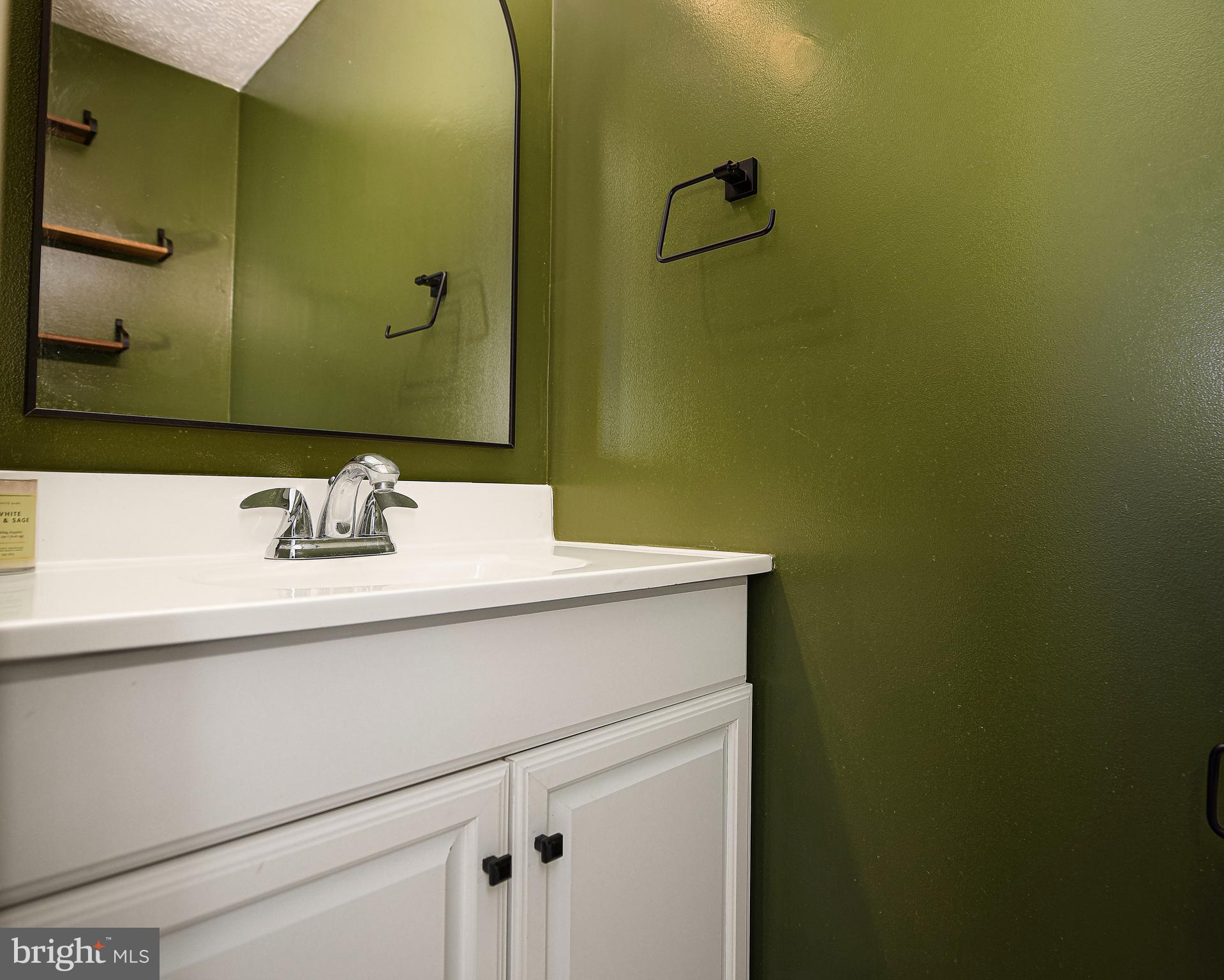 3702 Timahoe Circle Baltimore, MD 21236 - Photo 11 of 34 a bathroom with a sink and a mirror