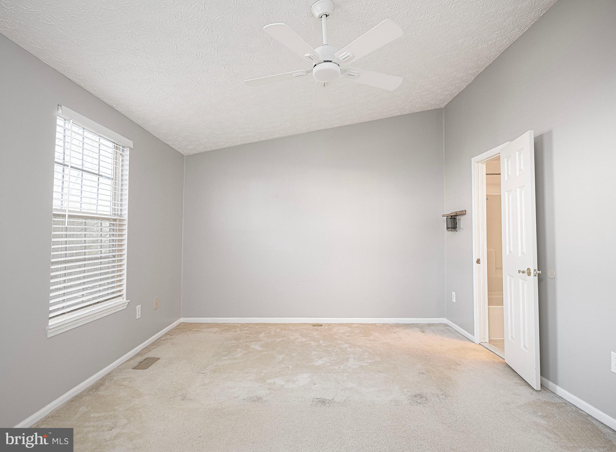 3702 Timahoe Circle Baltimore, MD 21236 - Photo 13 of 34 a view of an empty room with a window