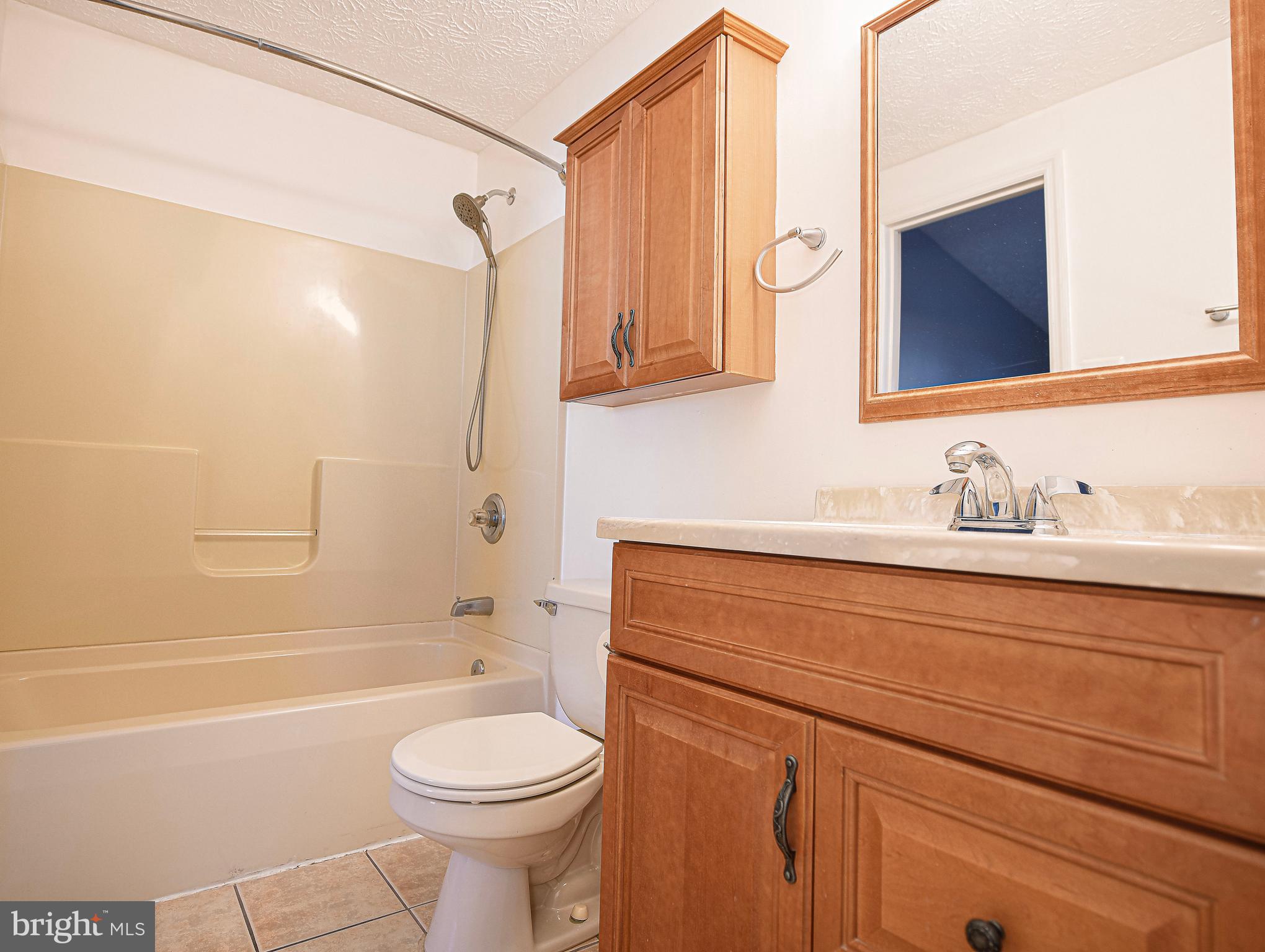 3702 Timahoe Circle Baltimore, MD 21236 - Photo 14 of 34 a bathroom with a sink a toilet and a bathtub