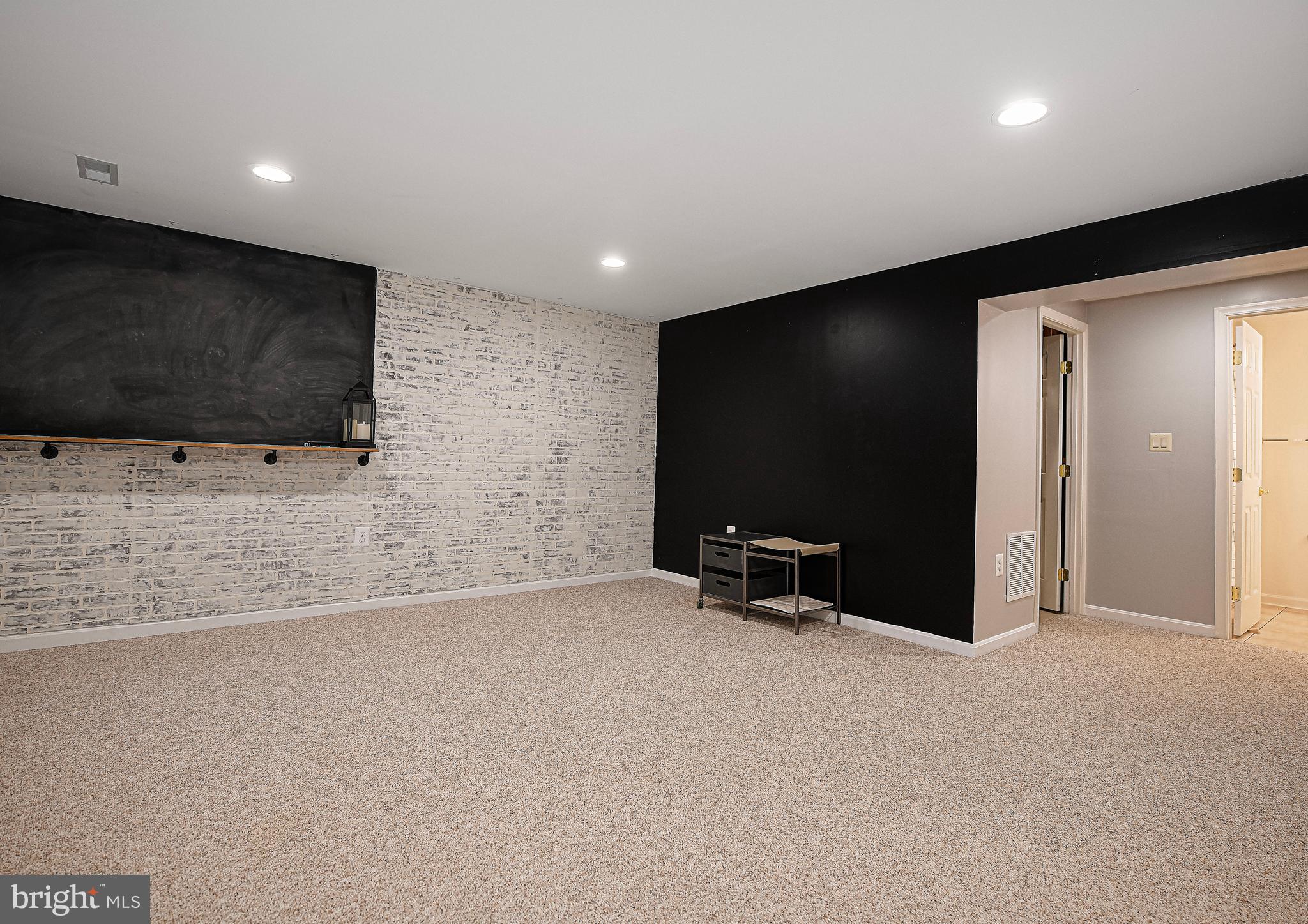 3702 Timahoe Circle Baltimore, MD 21236 - Photo 19 of 34 a view of an empty room with a flat screen tv