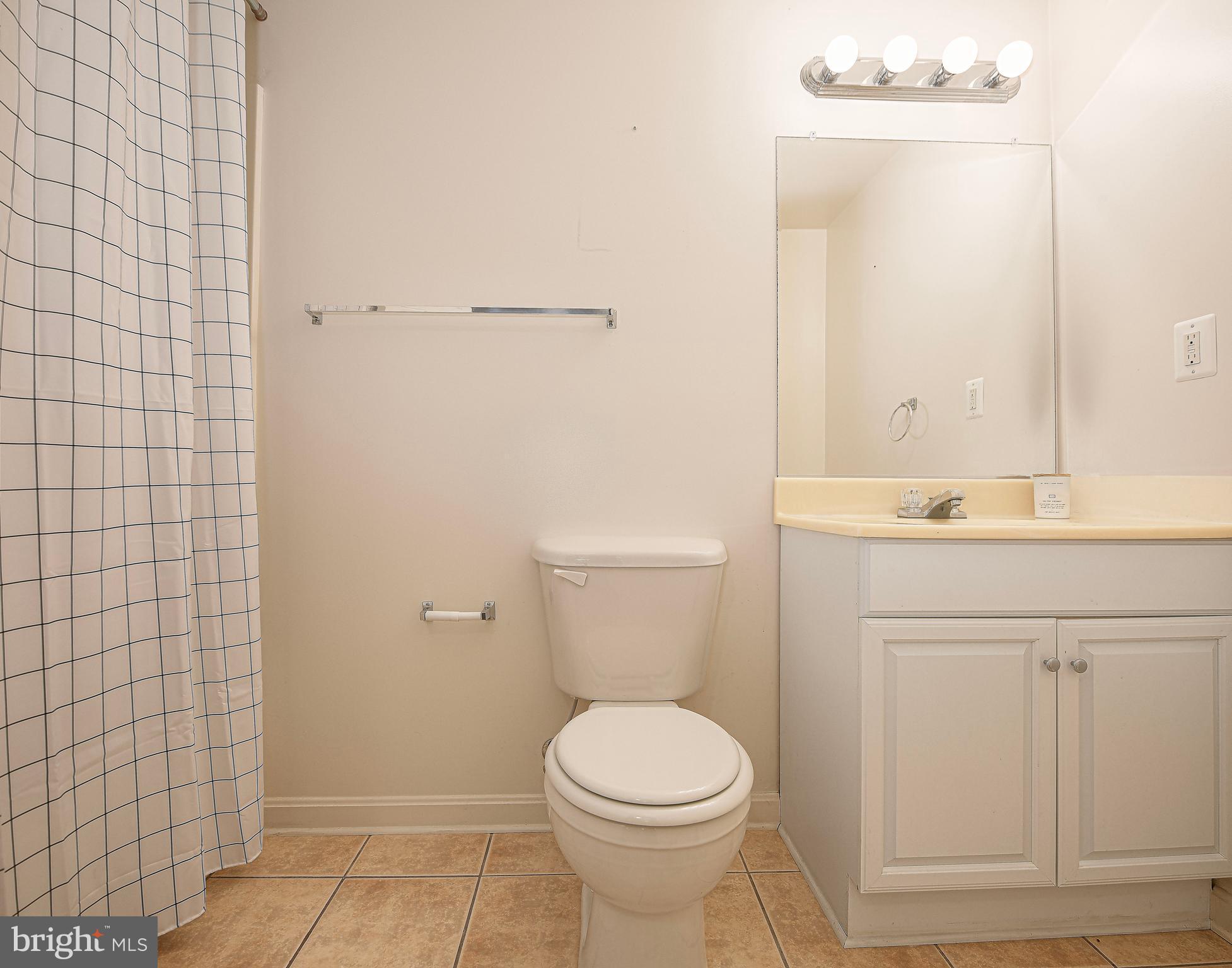 3702 Timahoe Circle Baltimore, MD 21236 - Photo 20 of 34 a bathroom with a sink a toilet and shower