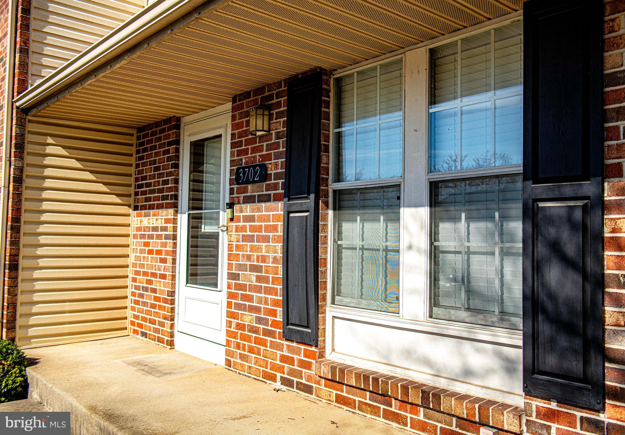 3702 Timahoe Circle Baltimore, MD 21236 - Photo 24 of 34 a view of a brick house with windows