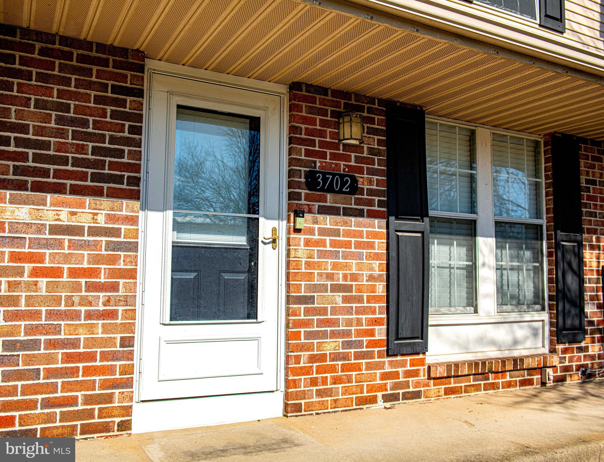 3702 Timahoe Circle Baltimore, MD 21236 - Photo 28 of 34 a view of a brick house with a large window