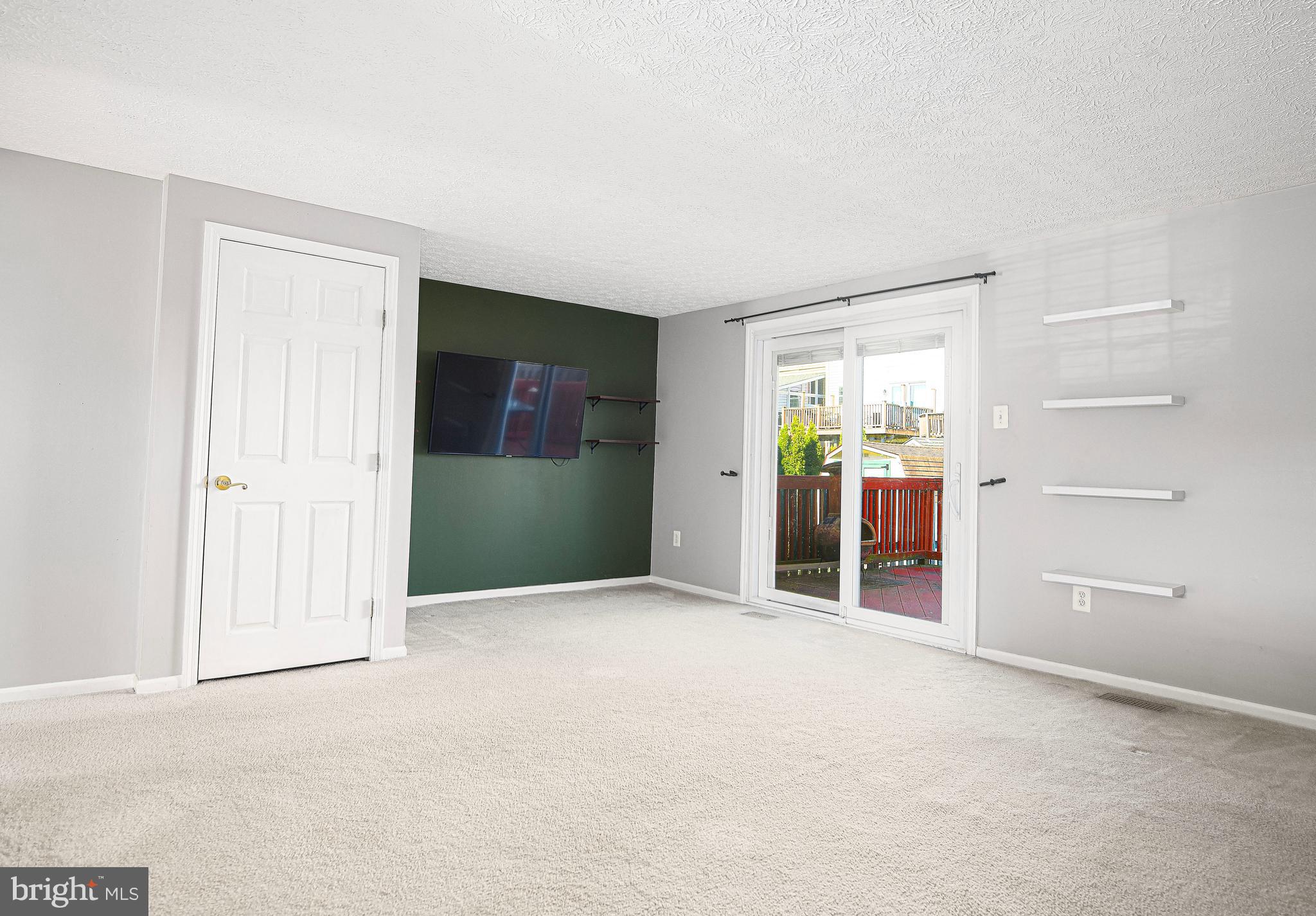 3702 Timahoe Circle Baltimore, MD 21236 - Photo 9 of 34 an empty room with closet and mirror