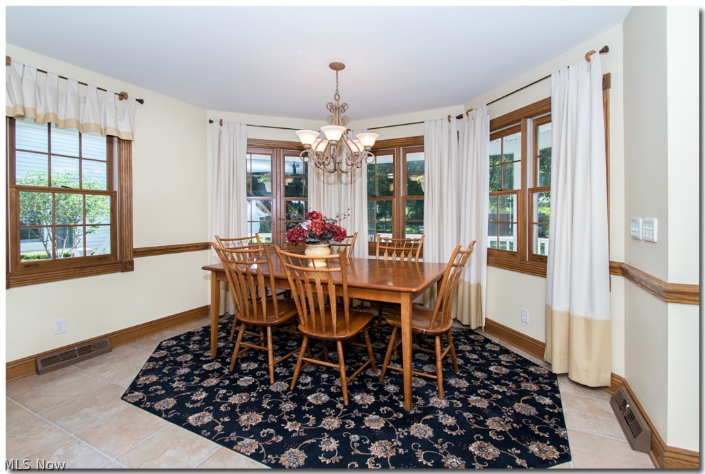273 Barrington Ridge Road Painesville, OH 44077 - Photo 11 of 25 THE MANY WINDOWS IN THE BREAKFAST ROOM MAKES MEAL TIME A HAPPY EVENT EVERY DAY.