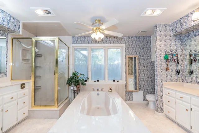 a kitchen with a sink a counter top space stainless steel appliances and cabinets
