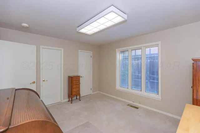 a dinning area with furniture and chandelier