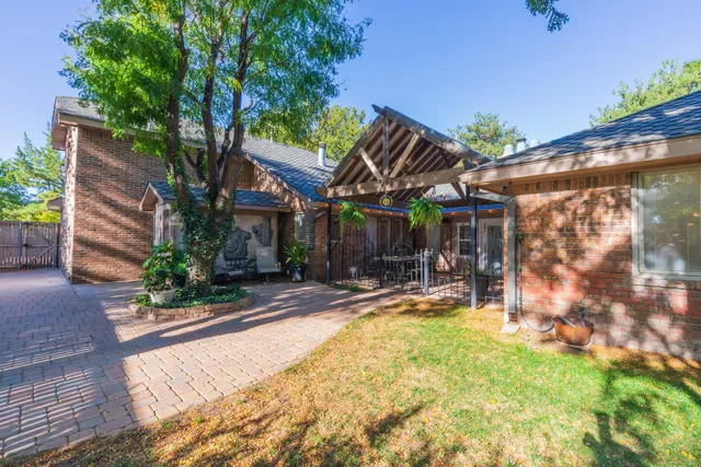 a bathroom with a sink a mirror and a shower