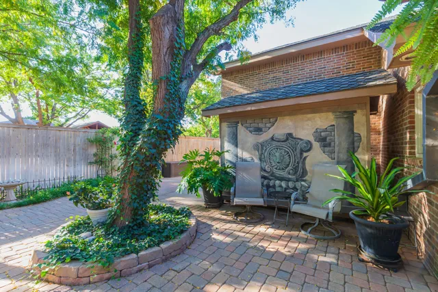 a bedroom with a bed couch and window
