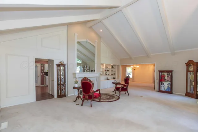 a view of swimming pool with wooden fence